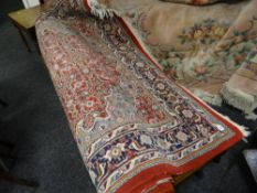 A large Middle Eastern-style woolen multi patterned rug