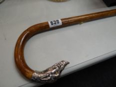 A sterling silver-handled boar's head walking cane with glass eyes