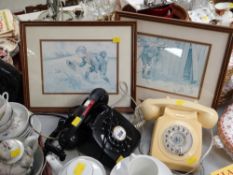 Two vintage BT telephones (one black, one cream) together with two framed prints