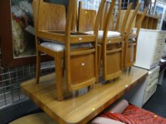 A 1930s-style Art Deco walnut veneered glass top dining table with six matching cushion insert