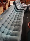 A 1970s retro pale blue velvet button backed three-piece suite together with a similar recliner