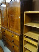 An antique mahogany press cupboard together with a shelving unit