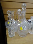 A Victorian etched glass decanter together with other cut glass decanters