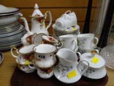 Royal Albert 'Old Country Roses' teaset together with a vintage West German decorated teaset