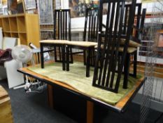 An Art Deco-style wood effect & ebonized bordered dining table together with four matching high back
