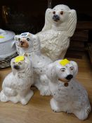 Four Staffordshire dogs