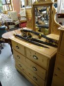 A vintage stripped pine mirror backed chest of drawers