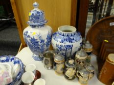 A large blue & white Masons willow patterned decorated lidded vase (A/F) together with another