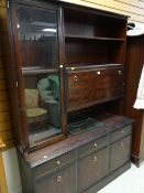 A Stag Minstrel lounge unit with upper shelving & glass cupboard base