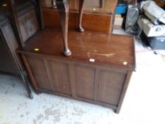 A vintage oak ottoman