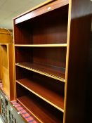 A modern low dark wood bookcase