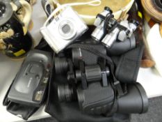 Pair of cased Simmons binoculars, two small Canon instamatic cameras, pair of Falcon miniature