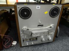 A vintage Akai four-track stereo reel-to-reel tape deck E/T
