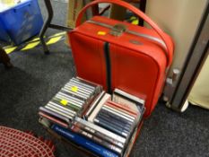 A collection of mainly classical CDs with some DVDs & a vintage red Antler overnight case