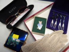 Ladies' collectables including Gucci sunglasses, leather gloves, enamelled compact