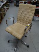A modern chrome & light suede office chair