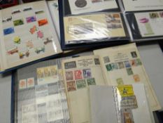 Four stamp albums containing mainly British with some foreign stamps including First Day Covers