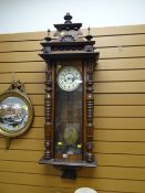 A large ornate Vienna wall clock