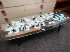 A retro decorated mirror topped Zodiac Long John coffee table