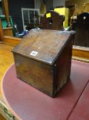 A small oak wall mounting candle box