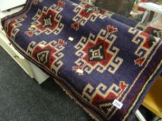 An old Baluchi woollen hand knotted rug in purple & red geometric pattern, 138 x 90cms
