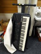 A Farfisa TK100 electric keyboard & stand