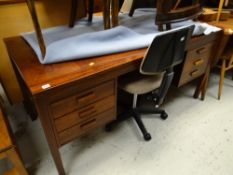 A vintage hardwood office-style desk with bank of three drawers to either side together with an