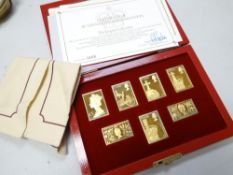 A boxed set of gold plated solid silver Empire Collection issue stamps