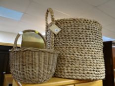 A large wicker log basket together with a shopping basket