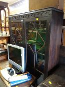 A vintage oak mahogany astragal glazed raised bookcase