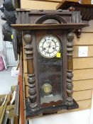 A Vienna wall clock with Roman numeral face