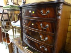 A reproduction Georgian-style mahogany bow fronted four-drawer chest of drawers
