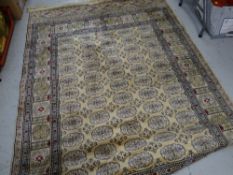 A modern patterned rug together with a modern oval brass framed wall mirror