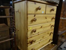 A modern honey pine small chest of drawers, two short above four long
