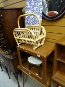 A parcel of furniture to include two small coffee tables, magazine rack, ironing boards