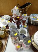 A collection of Staffordshire jugs, some lidded etc