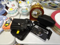 Vintage Rival camera together with a Canon camcorder, brass effect & decorated mantel clock