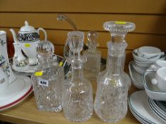Collection of cut glass decanters, glass birds