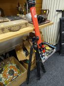 A Tasco tripod standing telescope