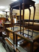 Two modern glass topped lamp tables together with a nest of two tables