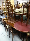A reproduction mahogany twin-pedestal based dining table together with six (4+2) cushion seated