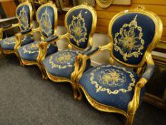 A modern reproduction French salon gilt & upholstered suite comprising four armchairs & a sofa