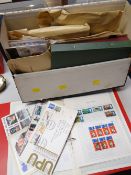 A large collection of loose stamps including First Day Covers together with stamp albums &
