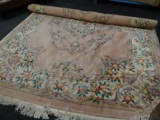 A large Chinese, washed cream and brown carpet