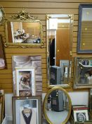 An ornate gilt bevelled hall mirror together with two similar gilt framed wall mirrors