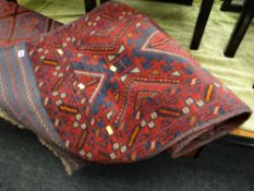 A Middle Eastern woollen meshwani woollen runner in a blue & red geometric pattern, 270 x 64cms