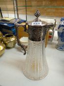 A fine quality silver collared & handled cut glass claret jug