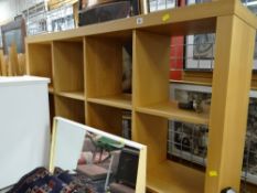 A modern lightwood shelving unit / room divider on castors & a copper fireguard