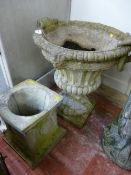A RECONSTITUTED STONE CAMPANA STYLE GARDEN URN on associated stand, 104 cms high overall