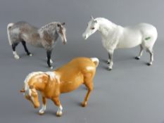 THREE BESWICK POTTERY HORSES including a grey Arab, a dapple hunter and a palomino, all in